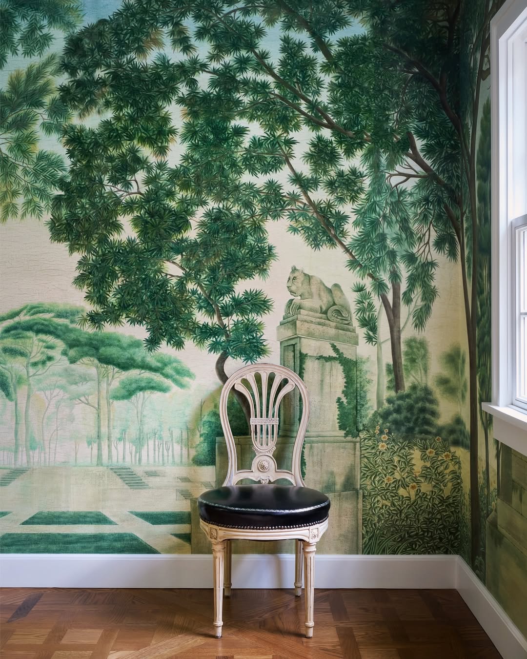Painted garden mural with a single chair in a 1920's casita